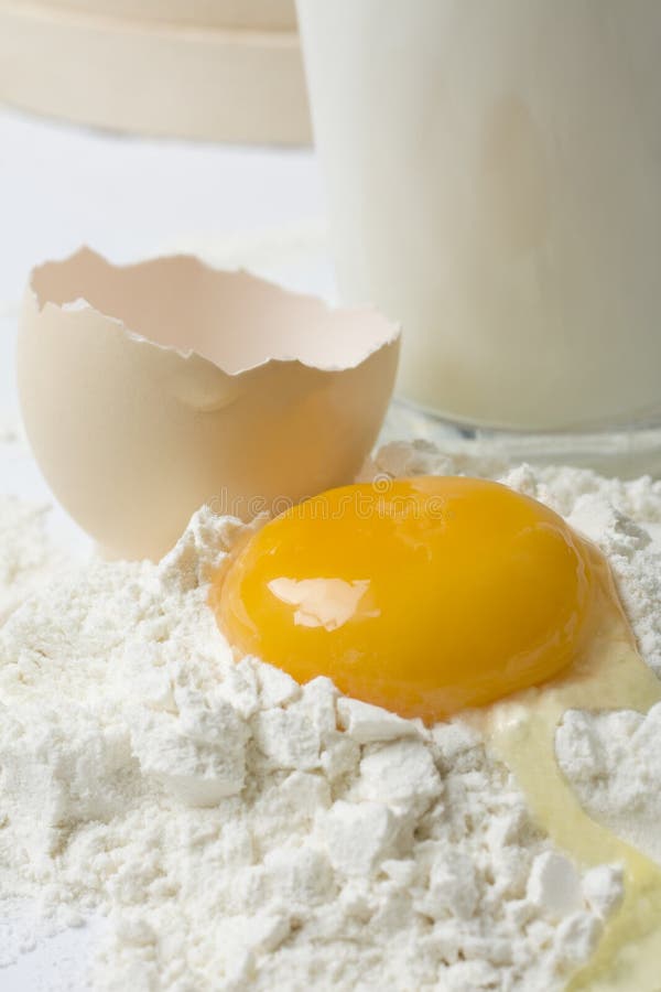 Raw Egg Yolk on Flour with Glass of Milk Stock Photo Image of open, natural 24404648