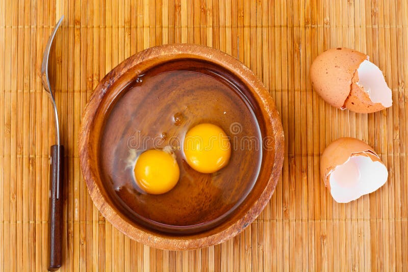 Raw Eggs on Wood Plate stock photo. Image of brown, eggs 72118304