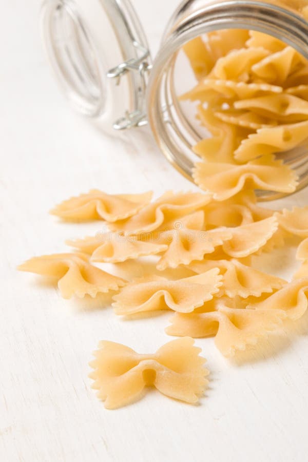 Raw farfalle bowtie pasta stock photo. Image of meal 86015252