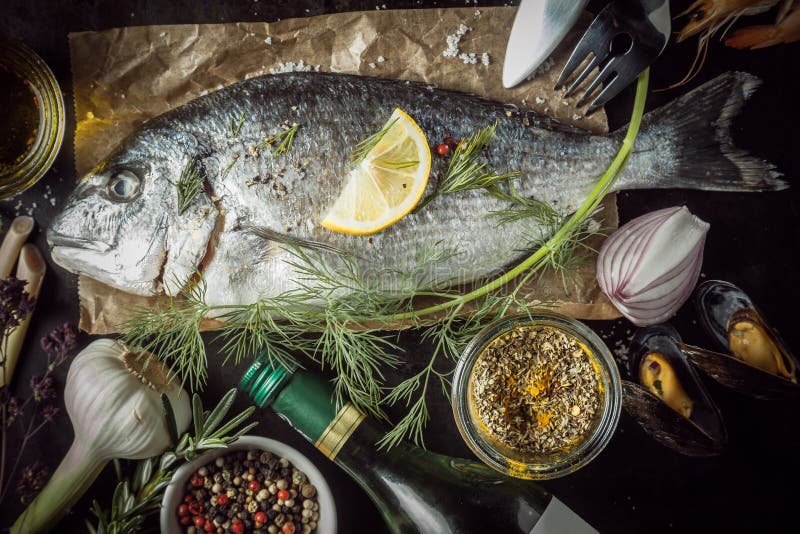 Raw Fish Surrounded by Seasonings and Ingredients Stock Photo - Image ...