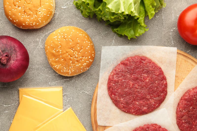 Raw Ground Beef Meat Steak Cutlets and Burger Ingredients on Grey Table Stock Photo Image of