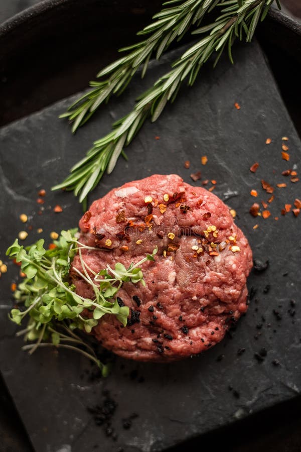 Raw Steak Cutlets or Patty with Mince Ground Beef Meat. Wooden