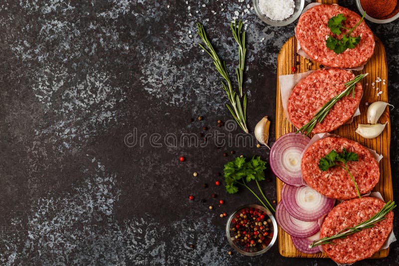 Raw Ground Beef Meat Steak Cutlets with Herbs and Spices. Stock Image