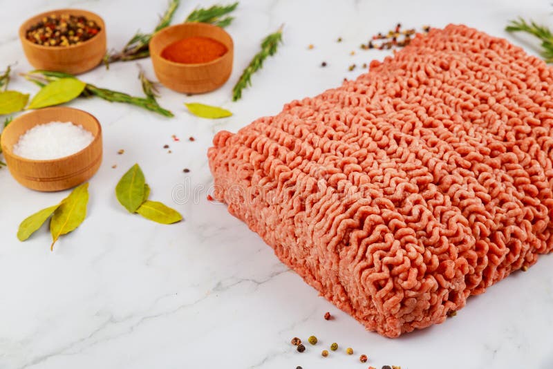 Raw Ground Beef with Spices, Rosemary and Bay Leaf Stock Photo Image
