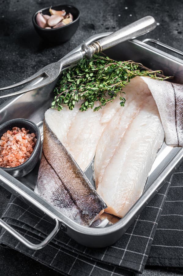 Raw Haddock Fish Fillets, Whitefish Meat in Kitchen Tray with Thyme