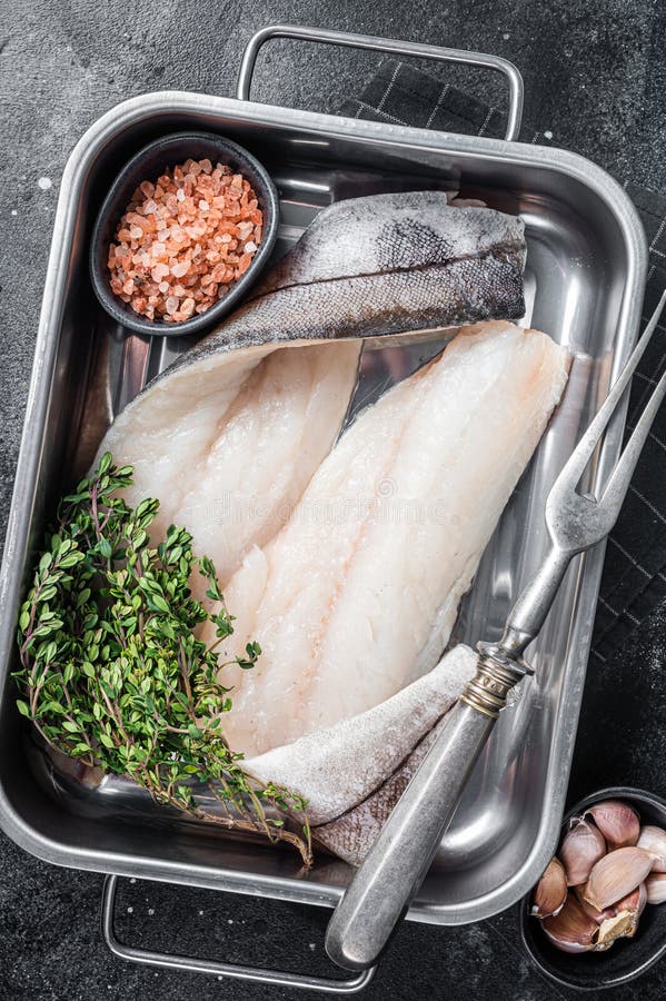 Raw Haddock Fish Fillets, Whitefish Meat in Kitchen Tray with Thyme