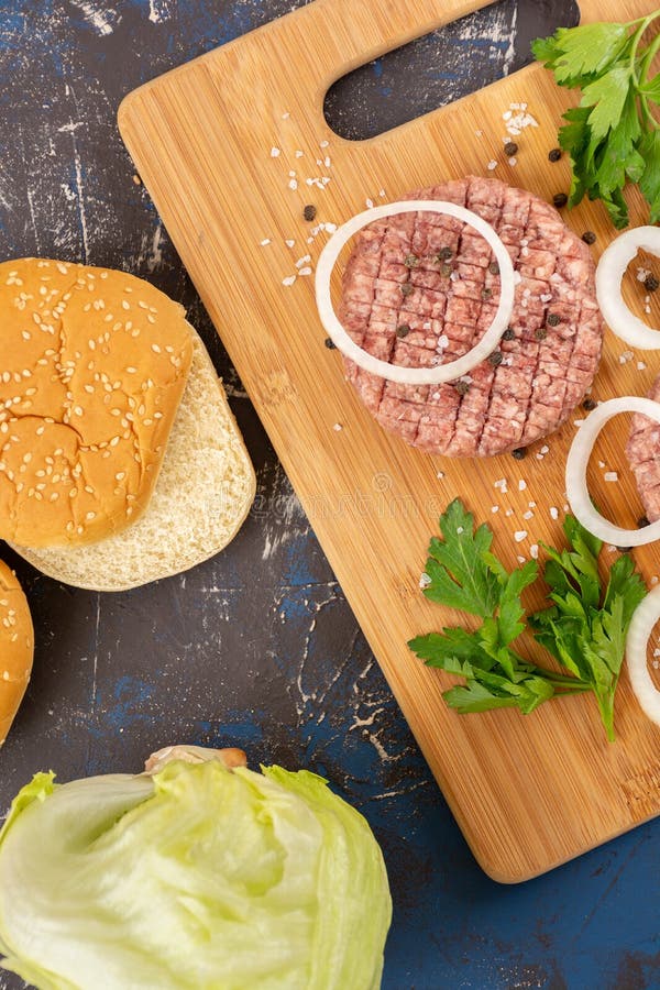 Raw minced beef burgers stock photo. Image of hamburger - 140525494