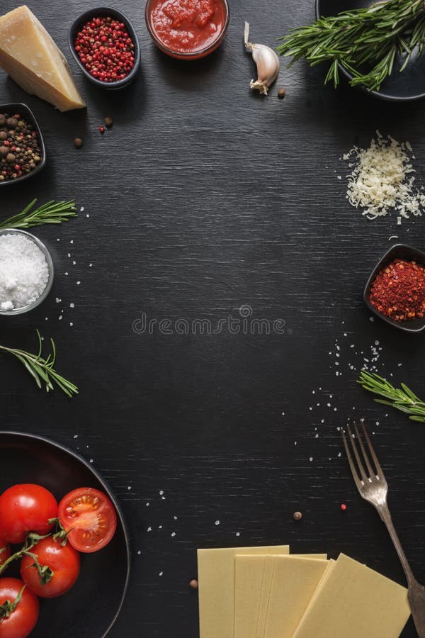 Raw Ingredients for Lasagna, Pasta,vegetables and Herbs on Black. Copy