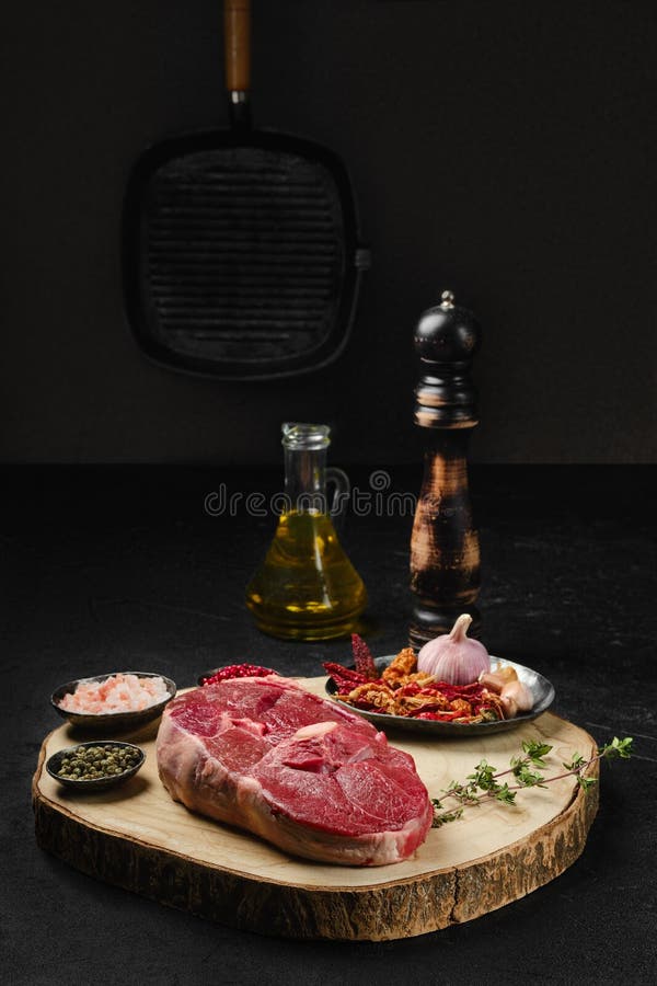 Raw Lamb Center Cut Leg Steak with Spice on the Kitchen Table Stock
