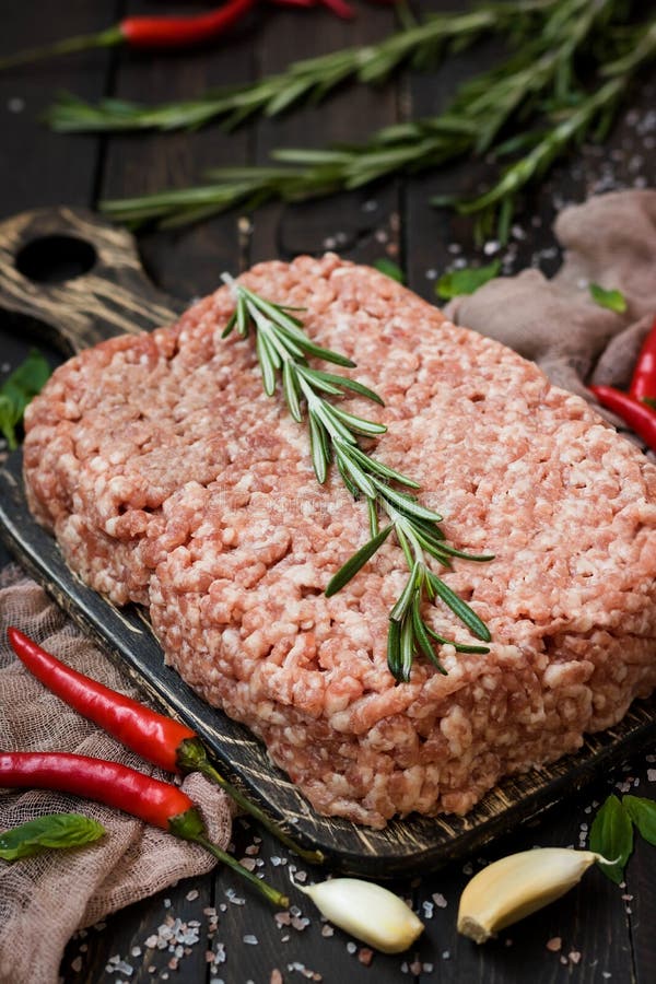 Raw Meat with Fresh Herbs and Pink Himalayan Salt Stock Photo Image