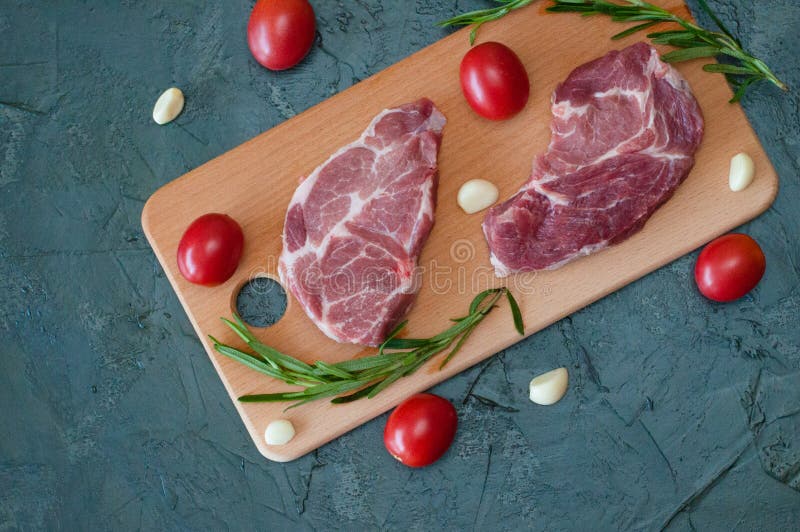 Raw Meat Pork with Rosemary Closeup, Flat Lay, Copy Space from Left
