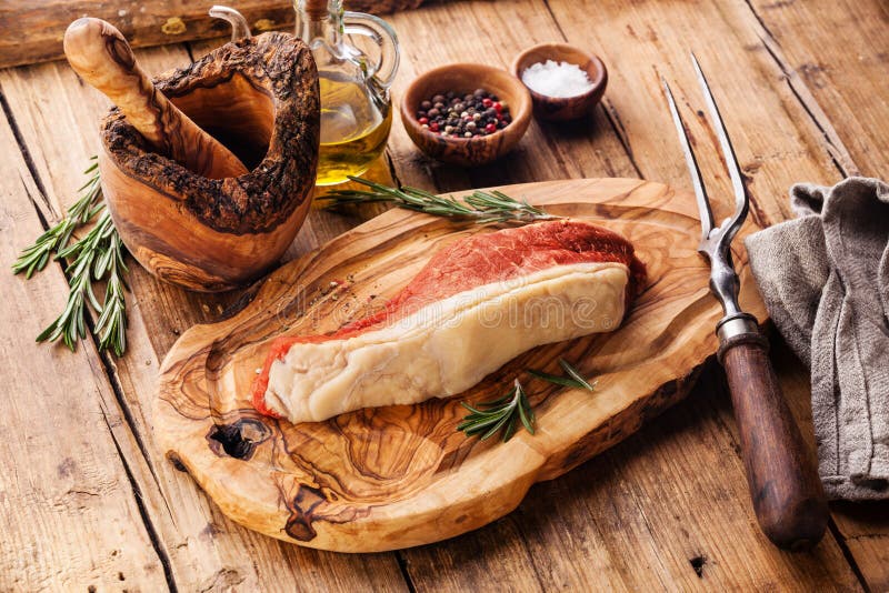 Raw meat Striploin steak and seasoning stock photography Raw meat Striploin steak and seasoning stock photography