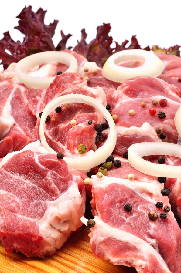 Raw Meet Pieces with Sliced Onion and Black Pepper Stock Photo Image