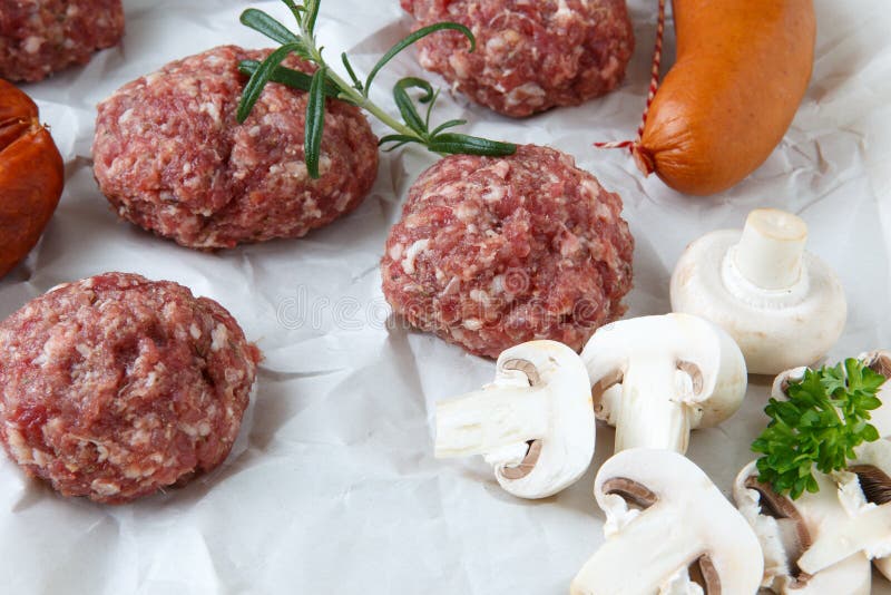 Raw Minced Hamburger Meat and Sausage with Herb and Spice Stock Image