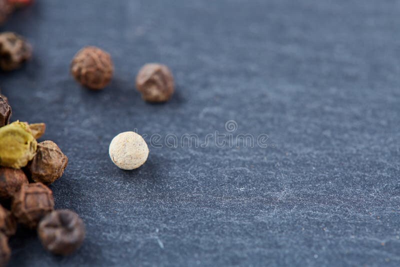 Raw, Natural, Unprocessed Peppercorns Macro on Dark Background with