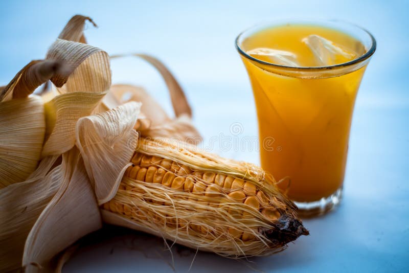 Raw Organic Corn Cob or Kernel Isolated on White Along with the Juice