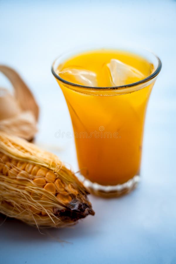 Raw Organic Corn Cob or Kernel Isolated on White Along with the Juice