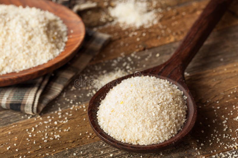 Raw Organic Dry Grits stock image. Image of spoon, ground 66537373