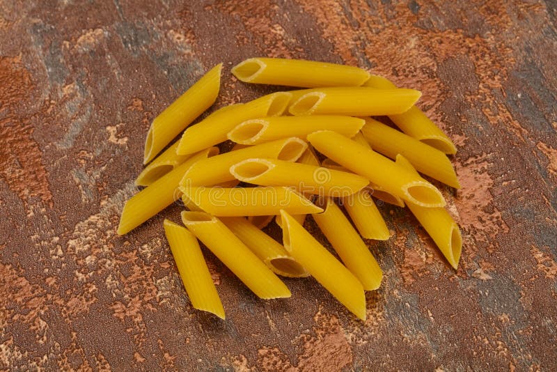 Raw penne pasta for bowl stock image. Image of white 197255919
