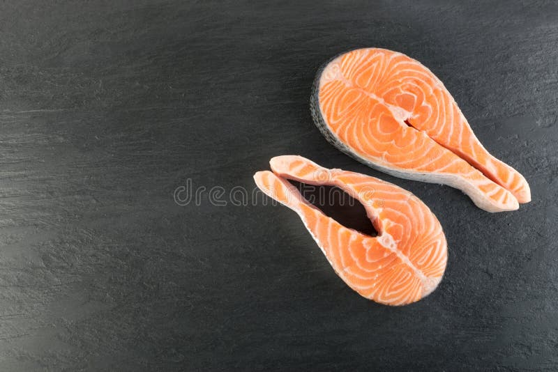 https://thumbs.dreamstime.com/b/raw-pink-salmon-steak-red-fish-chum-trout-fillet-slice-raw-pink-salmon-steak-restaurant-menu-close-up-natural-black-126455545.jpg