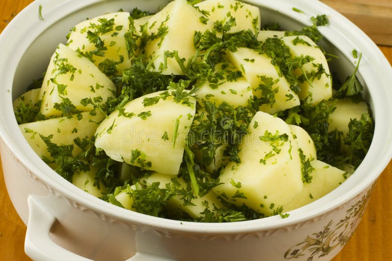 Raw potato cuts in a white bowl