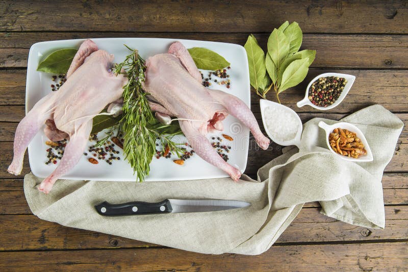 Raw poussin with herbs and spices