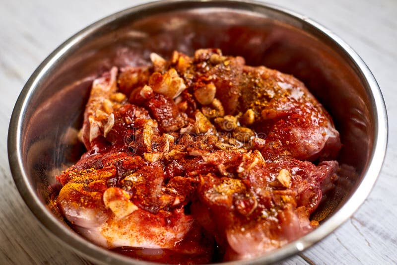 Raw Rabbit in a Bowl with Spices. Marinate Meat, Preparing for Cooking