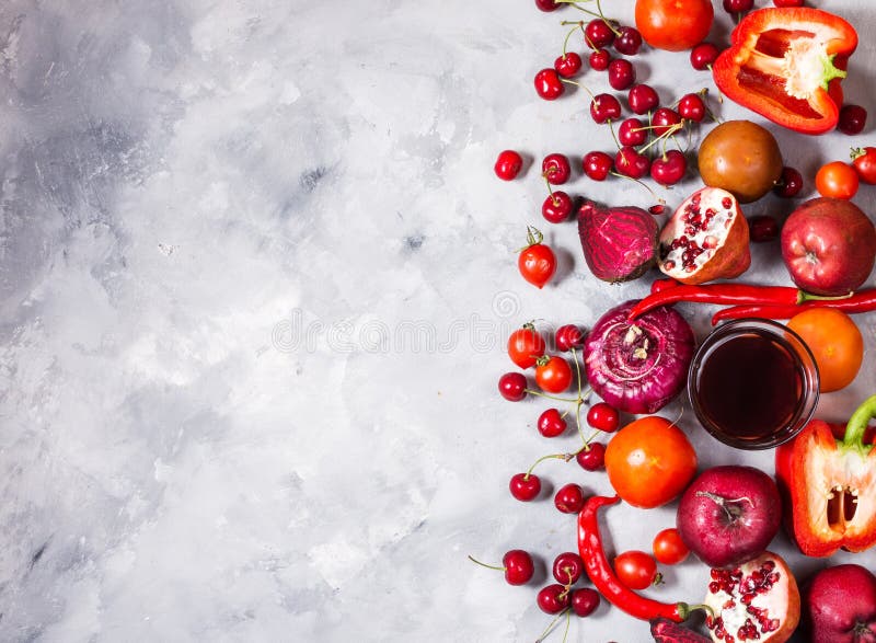 Raw red organic vegetables with fresh ingredients for healthily cooking on concrete background, top view. Vegan or diet food conce royalty free stock photos Raw red organic vegetables with fresh ingredients for healthily cooking on concrete background, top view. Vegan or diet food conce royalty free stock photos