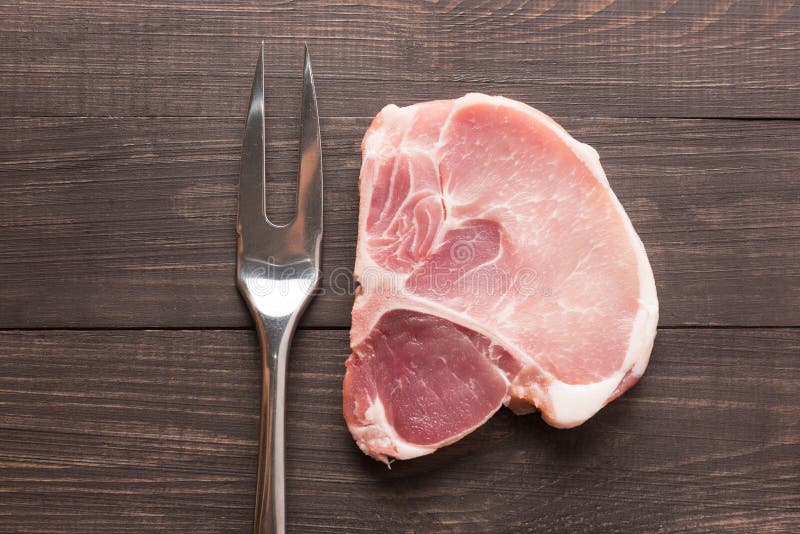 Raw Roast Meat and Meat Fork on Wooden Background Stock Image Image