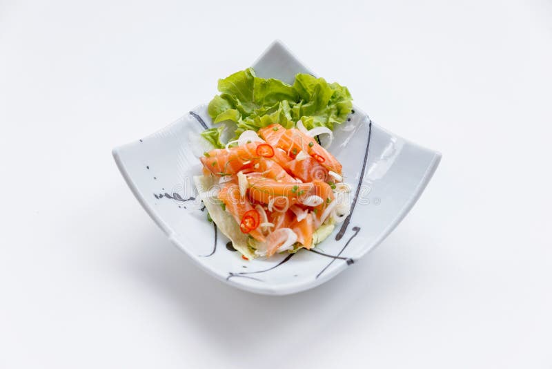 Raw Salmon Spicy Salad in Japanese Painted Ceramic Dish stock photos Raw Salmon Spicy Salad in Japanese Painted Ceramic Dish stock photos