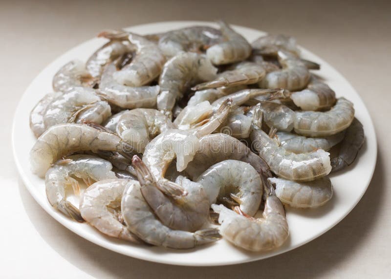 Raw Shrimps on a White Plate Stock Photo - Image of white, shrimps ...