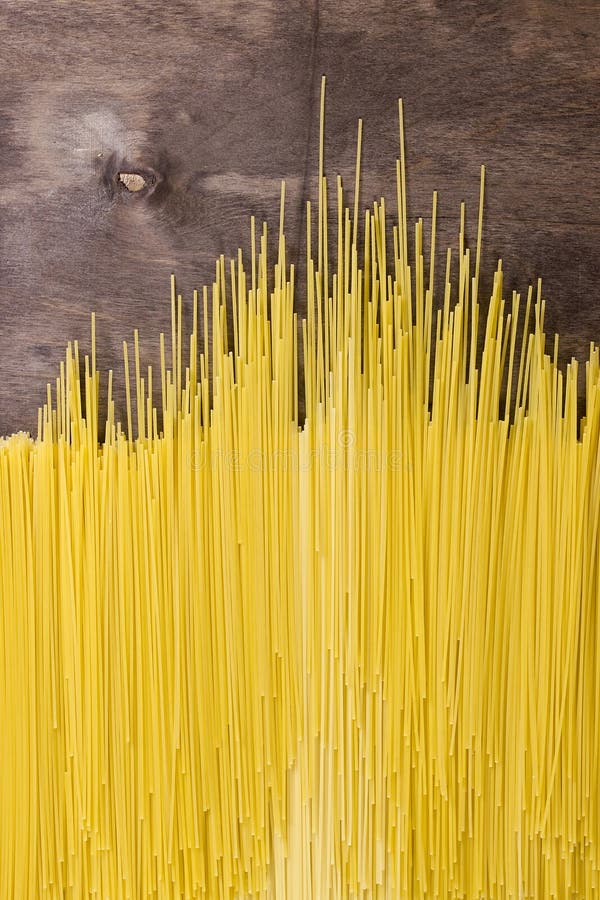 Raw spaghetti noodles stock photo. Image of bunch, cook 72815518