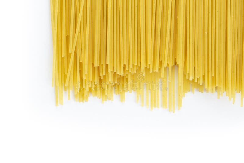 Raw Spaghetti on White Background. Yellow Italian Pasta Stock Photo