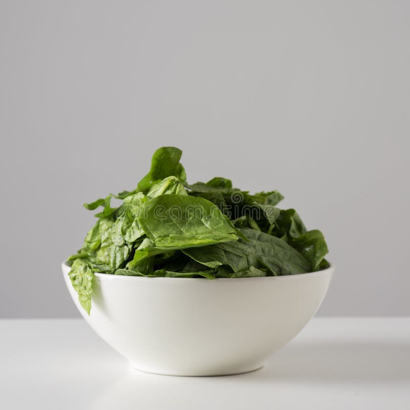 Raw Spinach Leaves in a White Bowl Stock Image - Image of ceramic