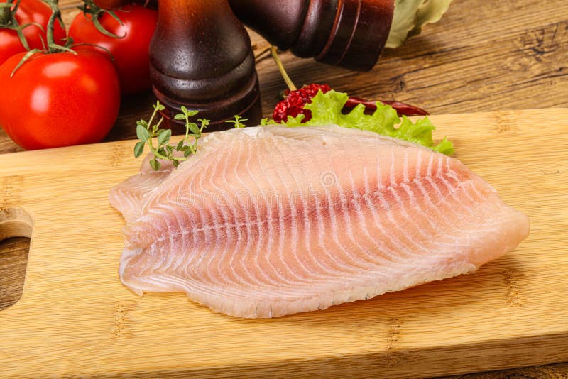 Raw Tilapia Fish for Cooking Stock Photo Image of black, board 209870472