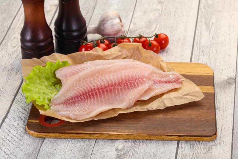 Raw tilapia fish stock image. Image of indoors, piece 151726799