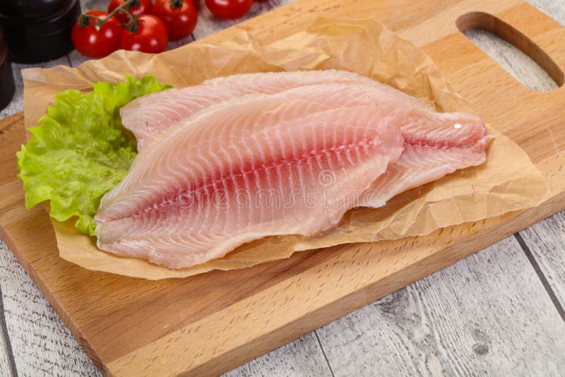 Raw tilapia fish stock image. Image of seasoning, food 154663999