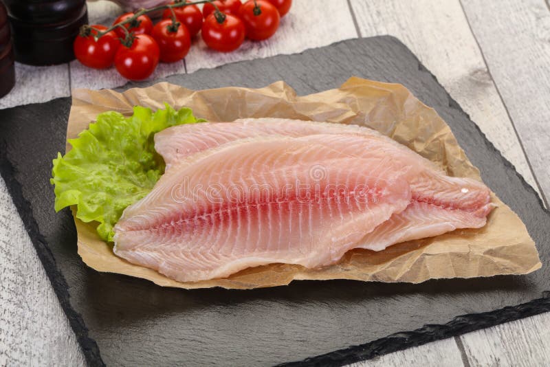 Raw tilapia fish stock photo. Image of healthy, filet 167130528