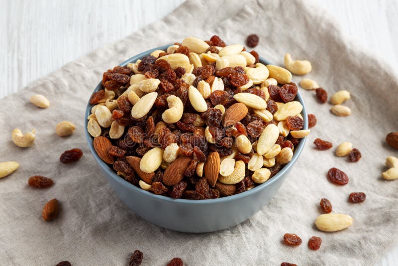 Raw Trail Mix with Nuts and Fruits in a Bowl, Side View Stock Photo