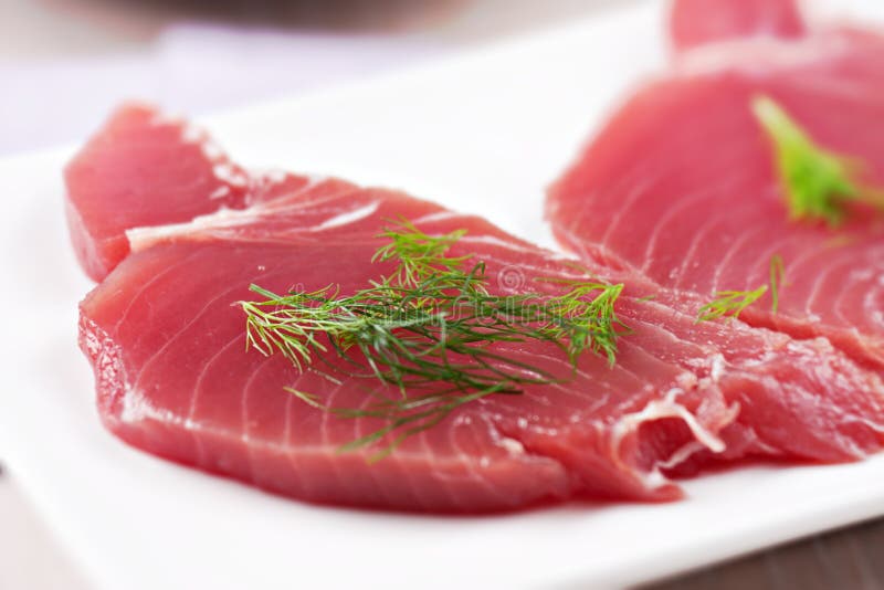 Raw Tuna steak. Raw fish on a plate stock images