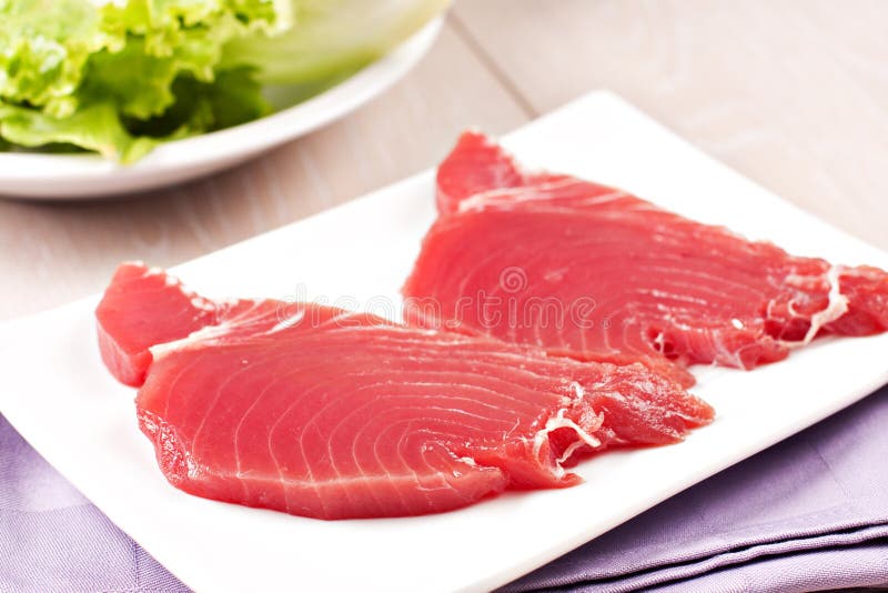 Raw Tuna steak. Raw fish on a plate stock images