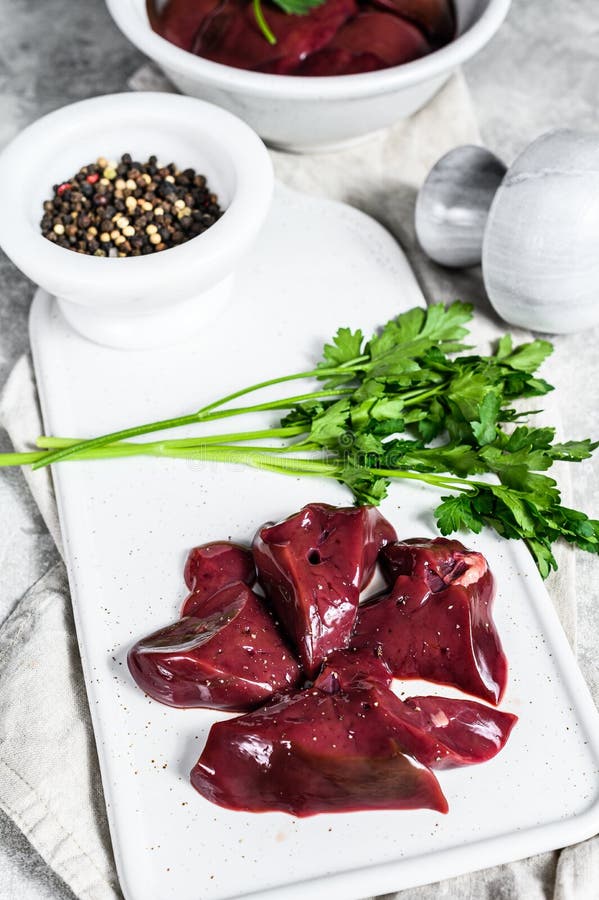 Raw Turkey Liver in a Bowl. Gray Background. Top View Stock Image