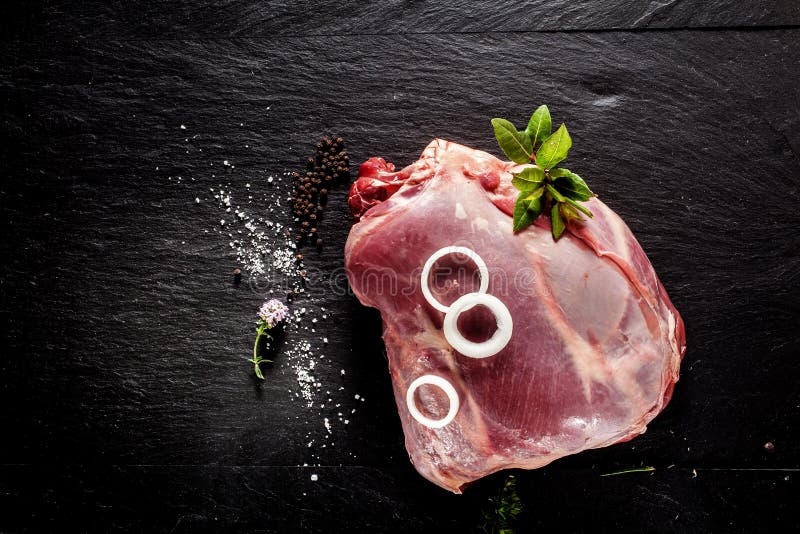 Raw Venison Roast Seasoned with Herbs and Spices