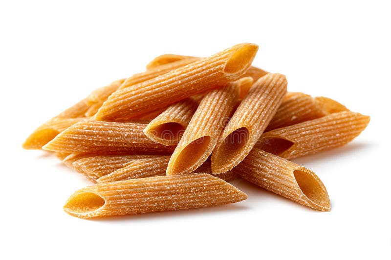 Raw wholegrain penne pasta uncooked on clean white background royalty free stock photography
