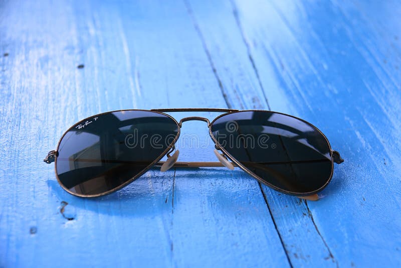 Ray-Ban Sunglasses on Blue Table Editorial Stock Image - Image of july,  1937: 122447179