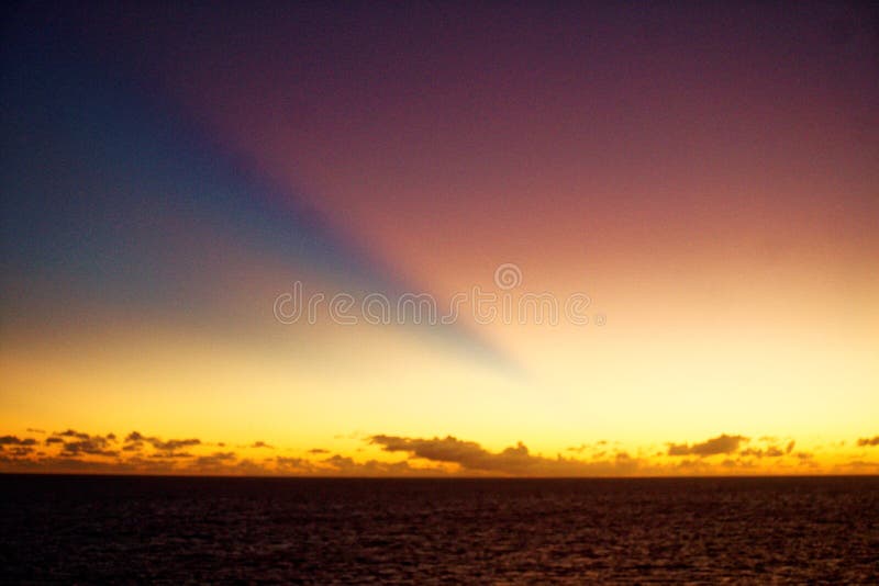 Crepuscular Rays, sometimes known as sun rays, sunbeams and god rays, at dusk over the mid-Atlantic Ocean. Crepuscular Rays, sometimes known as sun rays, sunbeams and god rays, at dusk over the mid-Atlantic Ocean