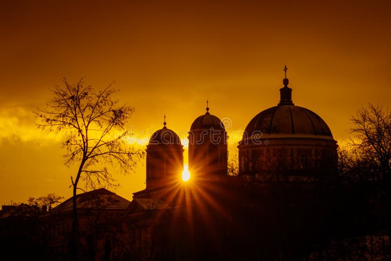 Rays of the sun at sunset make their way through the domes of Cathedral. The pro-Kafedral Catholic Cathedral of St stock photos