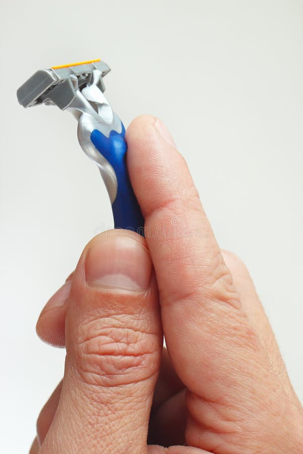 Razor in the hands of man closeup royalty free stock image Razor in the hands of man closeup royalty free stock image