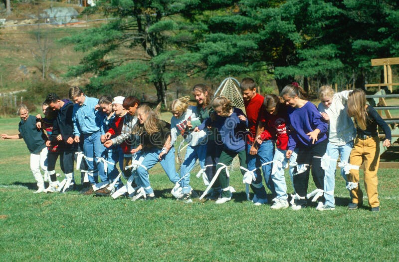 Three-legged race in a park, Massachusetts. Three-legged race in a park, Massachusetts