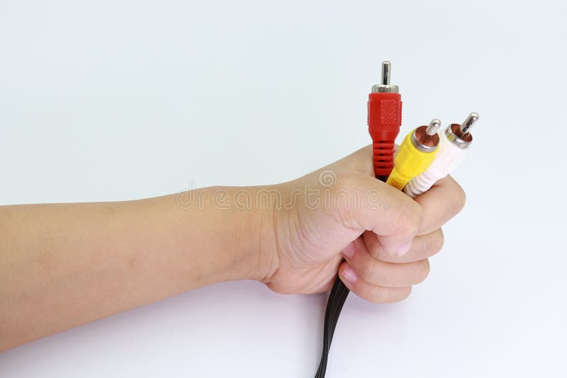 3 RCA Jack Plug Adapter Audio en la mano del niño aislada en el fondo blanco fotos de archivo libres de regalías 3 RCA Jack Plug Adapter Audio en la mano del niño aislada en el fondo blanco fotos de archivo libres de regalías